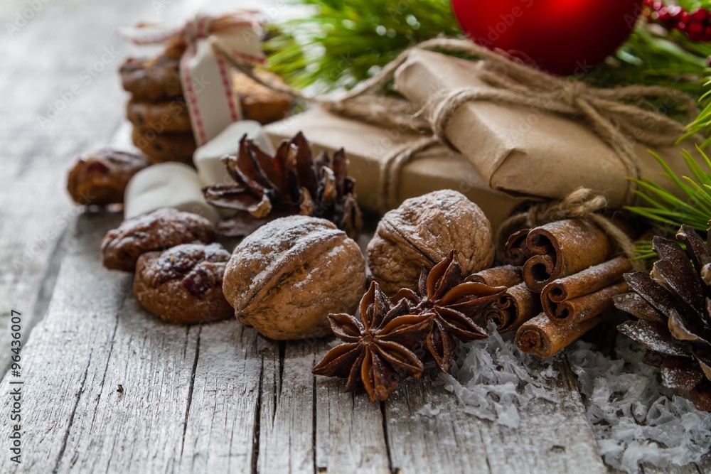 Christmas presents and symbols, rustic wood background Christmas presents and symbols, rustic wood background