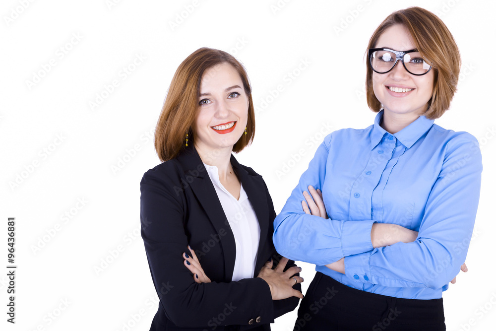 Two businesswomen stand together and smile Two businesswomen stand together and smile