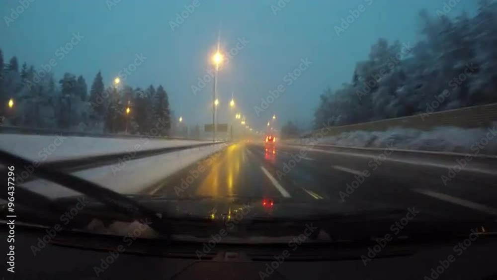 Driving car on snowy highway road Driving car on snowy highway road