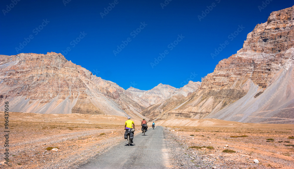 Cyclist in Himalayas mountains, North India 