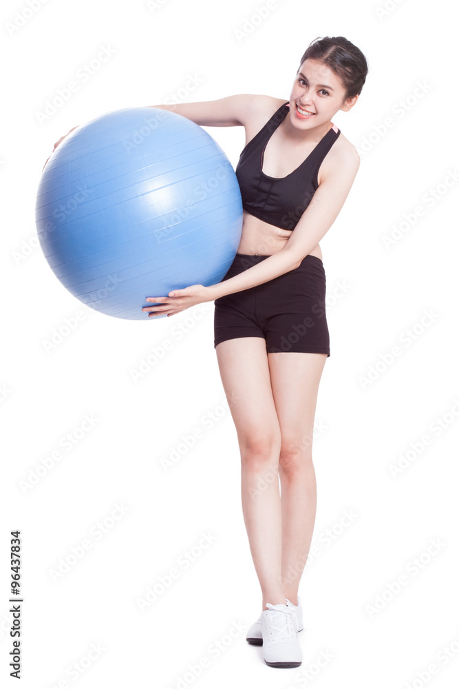 Full length young woman doing exercises with fitness ball. Full length young woman doing exercises with fitness ball.
