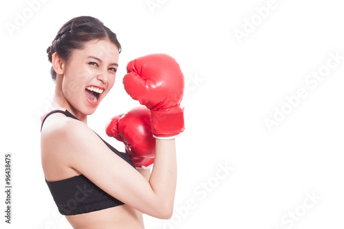 Boxer - portrait of fitness woman boxing wearing boxing gloves on white background. © japhoto
