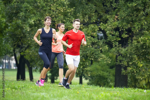 Young people running in the...