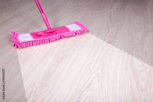 cleaning, before and after concept - wooden floor with pink mop