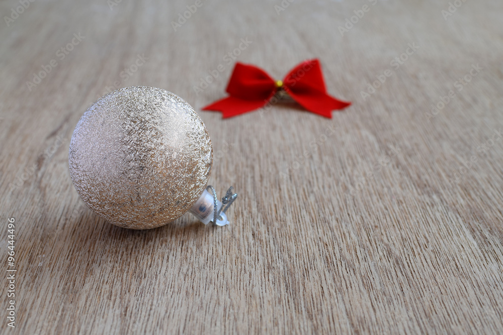 Christmas ball with red ribbon and bows, selective focus Christmas ball with red ribbon and bows, selective focus