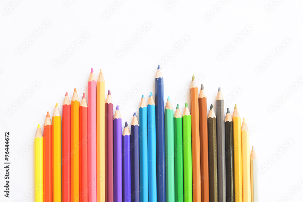 Closeup of Colour pencils on white background, selective focus Closeup of Colour pencils on white background, selective focus