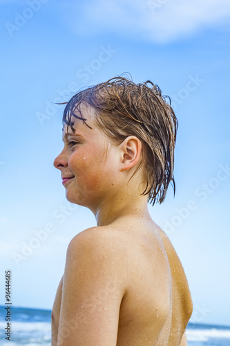 caucasian teenage boy enjoys  the beach © travelview