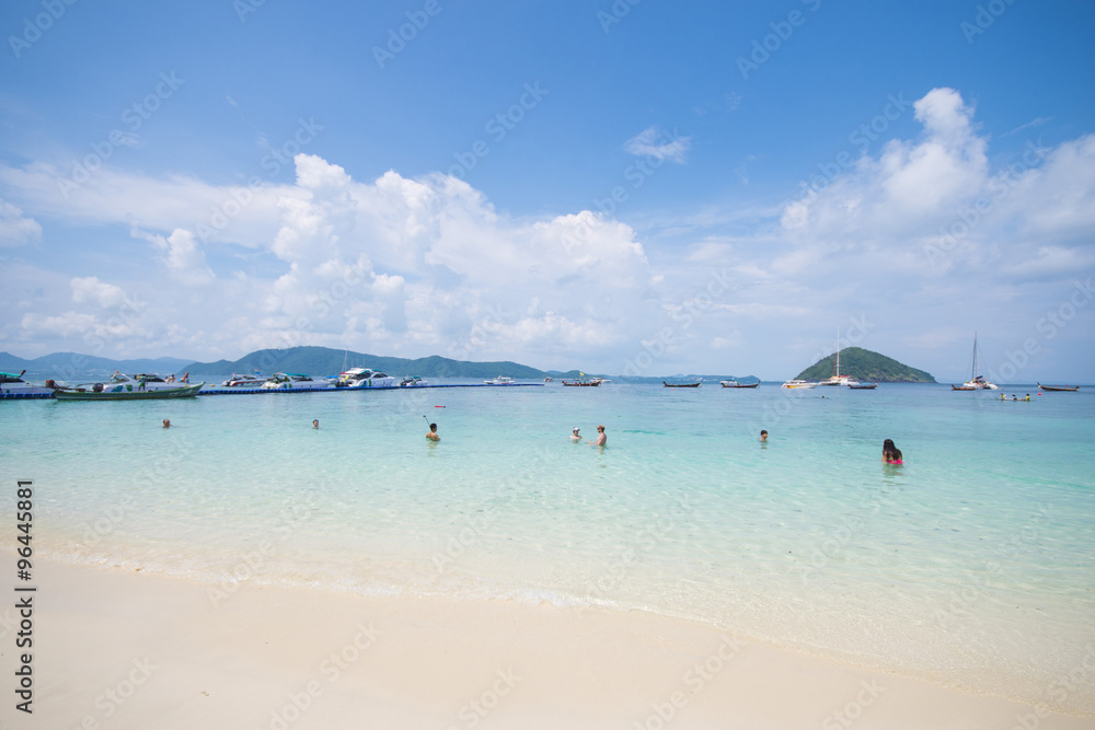 Tourists enjoy swimming at the coral island