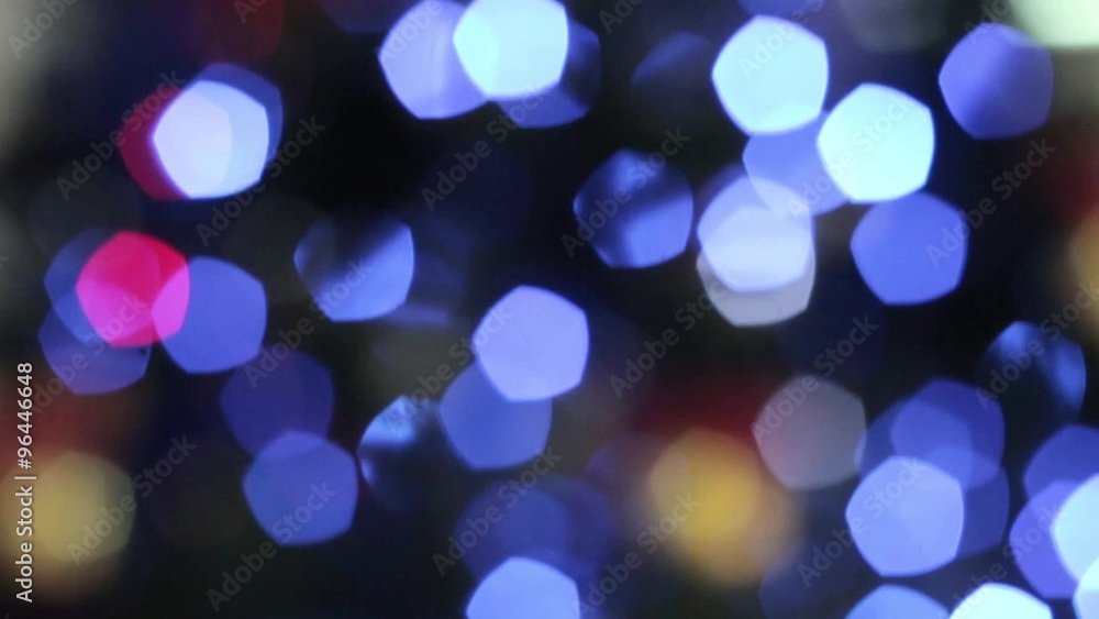 Closeup of toy with bells near illuminated christmas tree out of focus Closeup of toy with bells near illuminated christmas tree out of focus