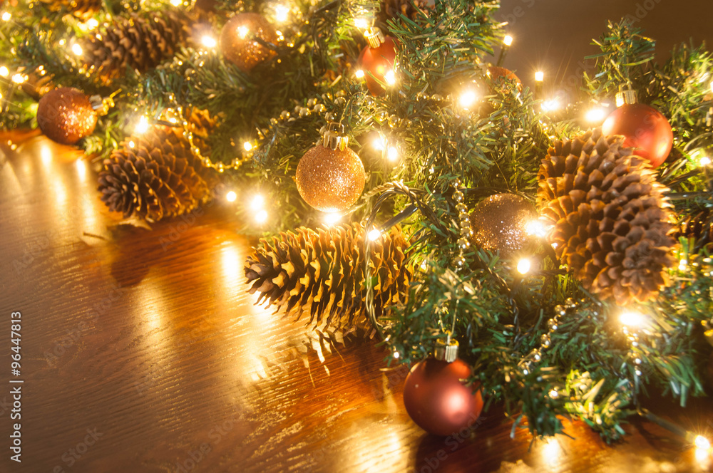 Christmas tree branches with red balls, golden garland and fir-cone Christmas tree branches with red balls, golden garland and fir-cone