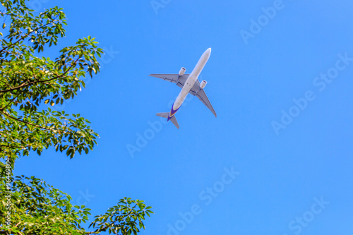 Plane prepare landing on blue sky