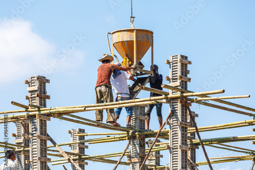 Worker working in construction on blue sky