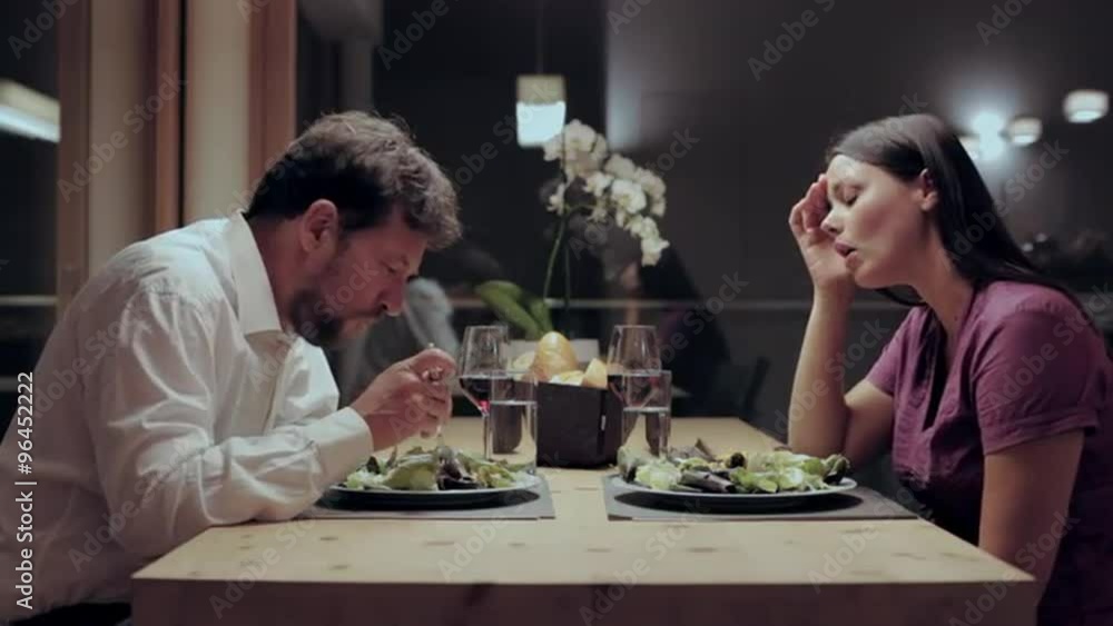 Woman yelling at husband during dinner at home angry