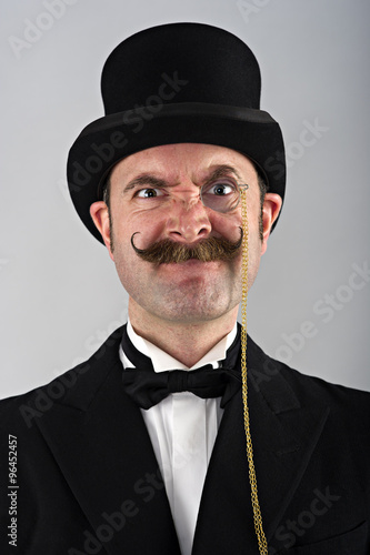 Charicature portrait of man in top hat and monocle
