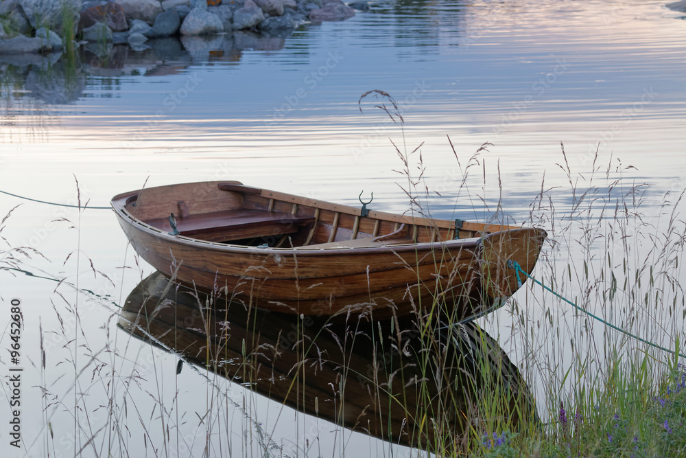 Rowboat in calm water in the harbour