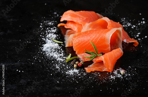 Salted salmon with rosemary and pepper photo