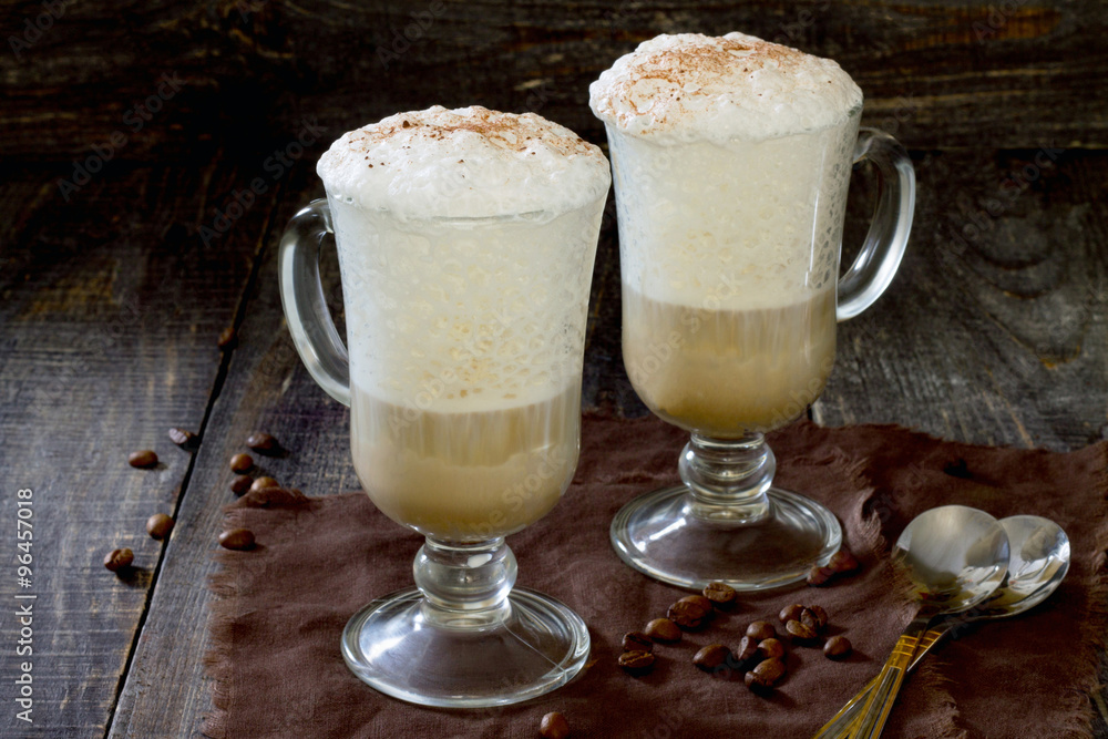 Cappuccino on the wooden table in rustic style Cappuccino on the wooden table in rustic style