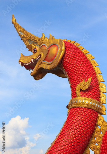 Serpent king or king of naga statue on blue sky in thailand