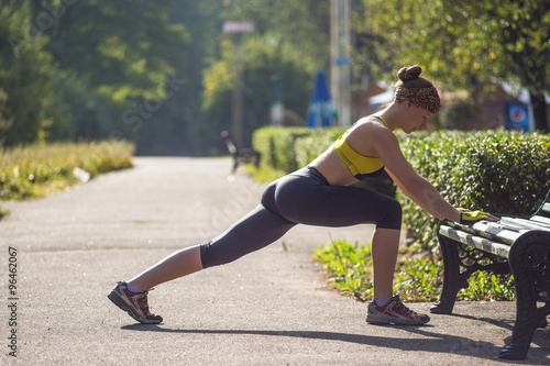 Fitness woman doing push-ups during outdoor cross training workout