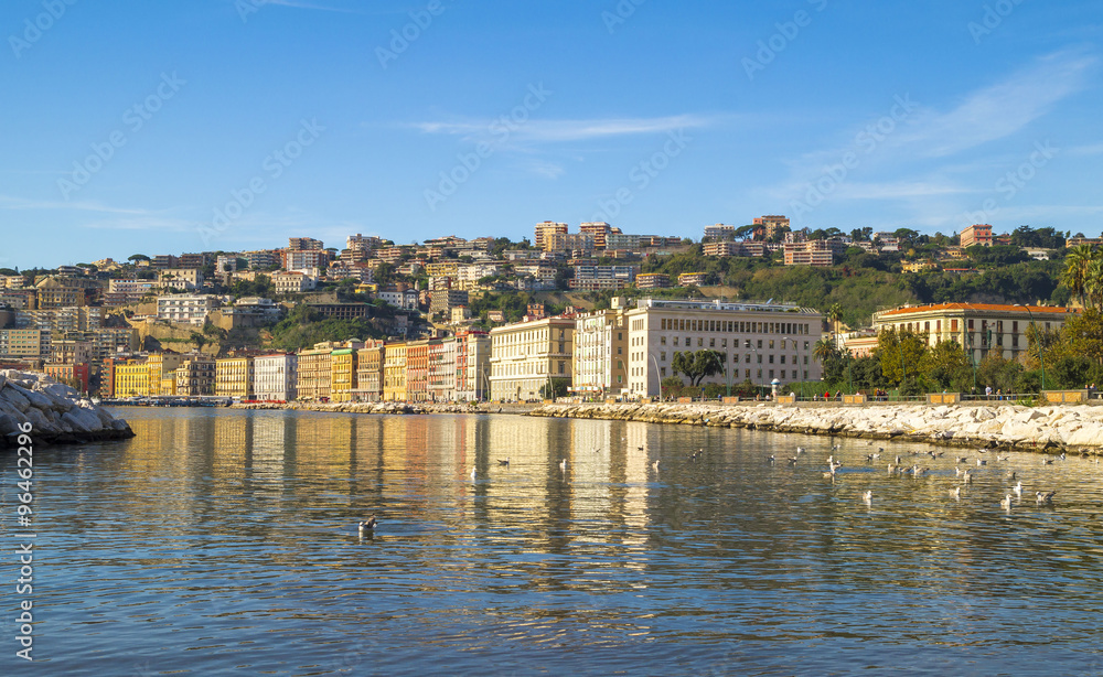 Mediterranean Sea and buildings resort on Lungomare - seashore of Napoli along the touristic harbor of Mergellina.