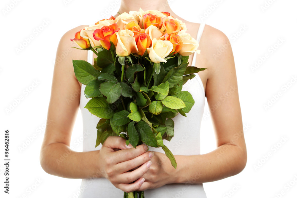 Female hands holding bouquet of orange roses