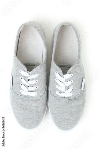 Pair of grey shoes isolated on white