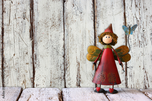 cute fairy on wooden table and background © tomertu
