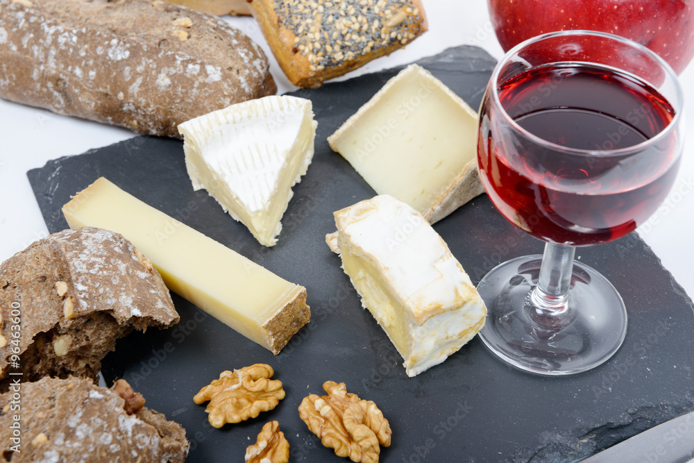 french cheese platter with a glass of red wine