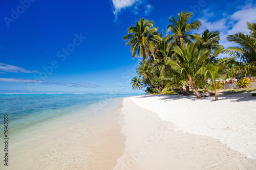 Beautiful tropical beach at exotic island in South Pacific photo