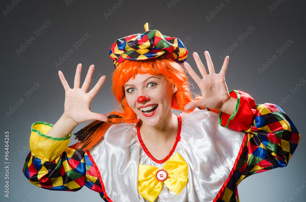 Clown in funny concept on dark background Clown in funny concept on dark background