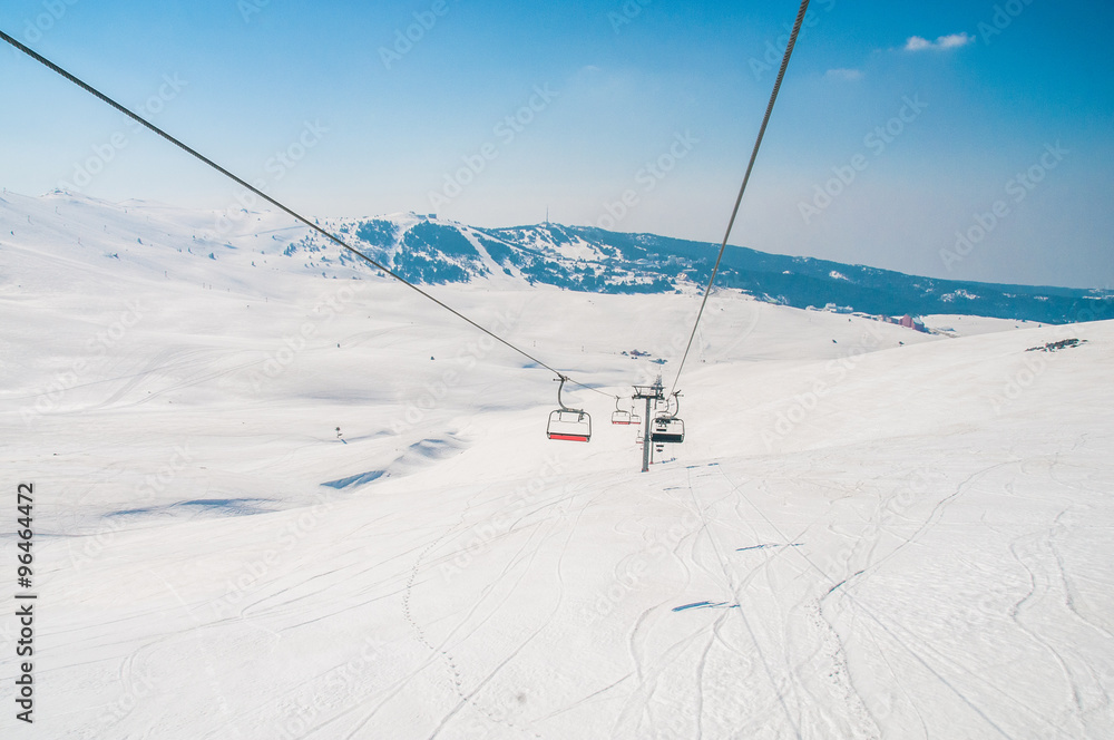 Ski lifts durings bright winter day Ski lifts durings bright winter day