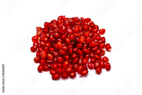 Pomegranate seeds isolated on white.