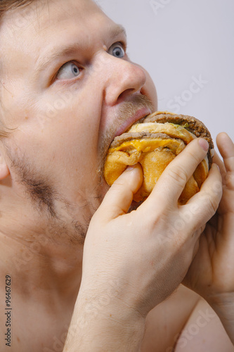 man eating a hamburger