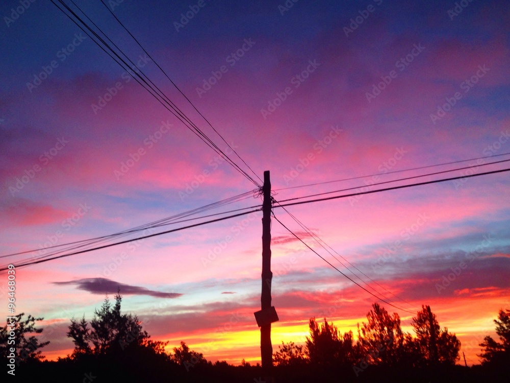 purple sunrise by power lines