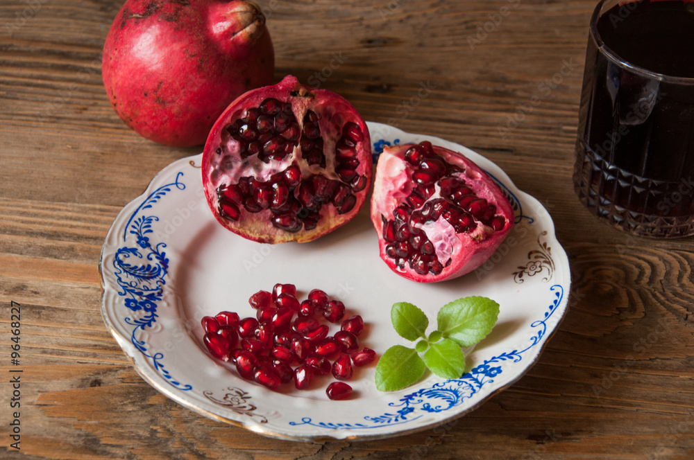 pomegranate on the wooden background pomegranate on the wooden background