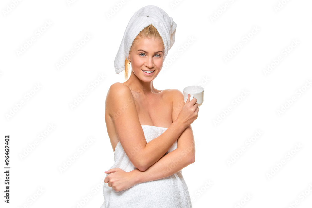 Young attractive woman in towel holding a cup Young attractive woman in towel holding a cup