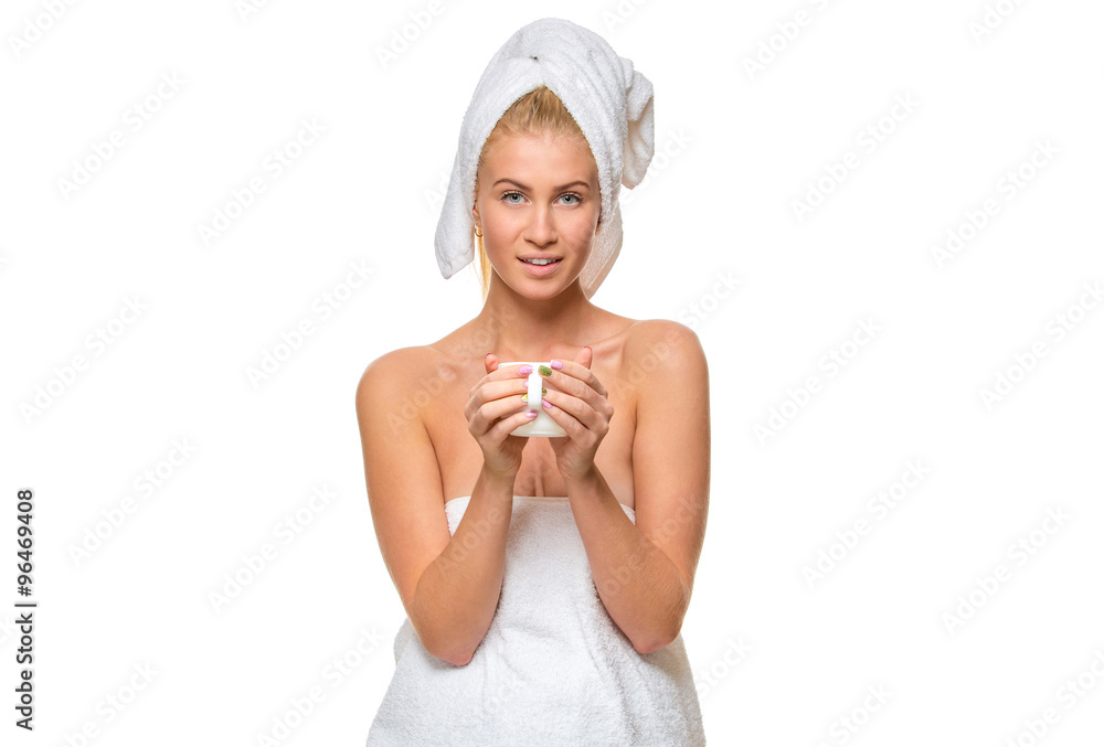 Young attractive woman in towel holding a cup Young attractive woman in towel holding a cup