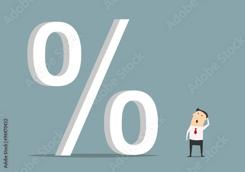 Businessman looking up at big percent symbol