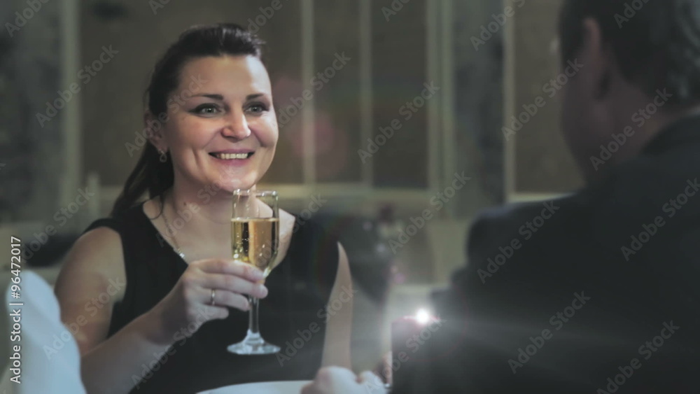 A MIDDLE-AGED COUPLE HAVING DINNER A MIDDLE-AGED COUPLE HAVING DINNER