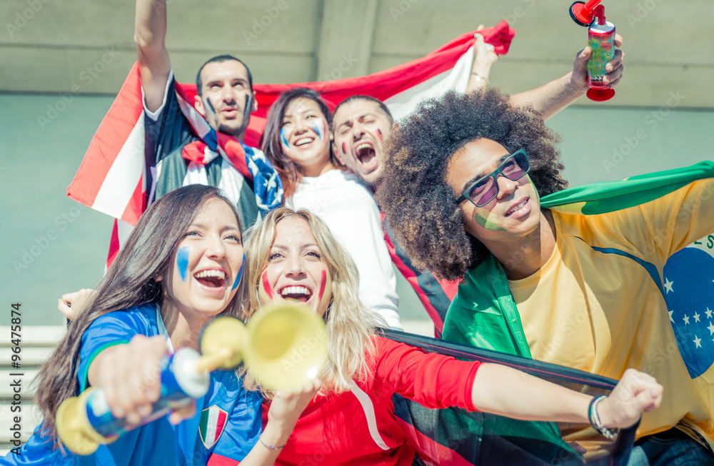 Obraz premium Group of fans supporting their team at the arena