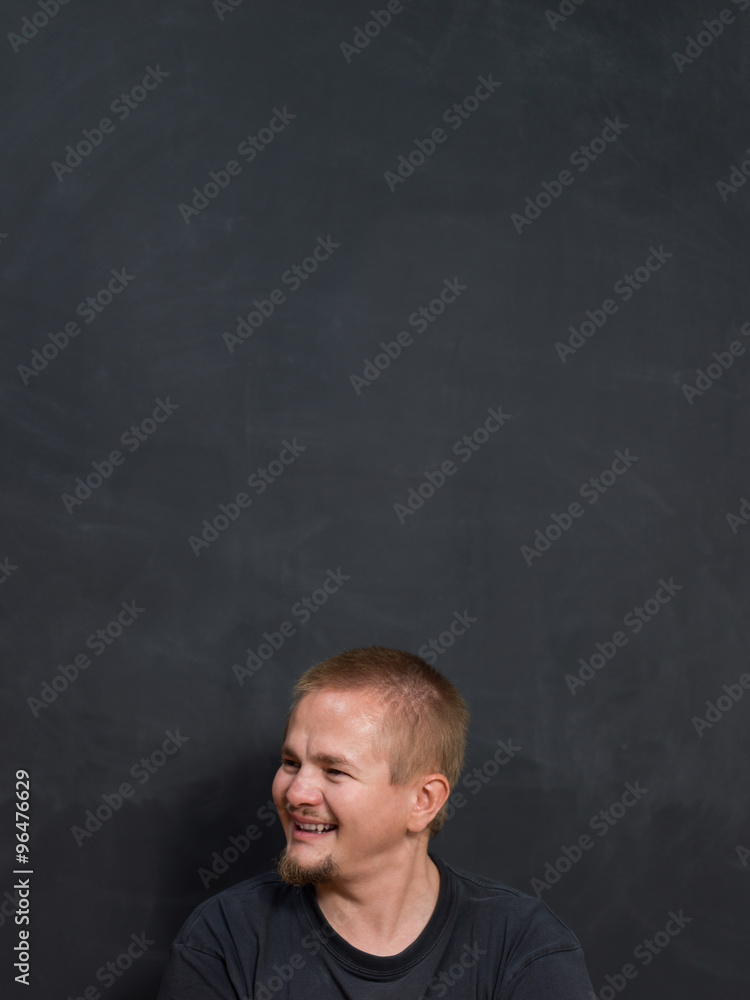 smiling student or teacher at the blackboard smiling student or teacher at the blackboard