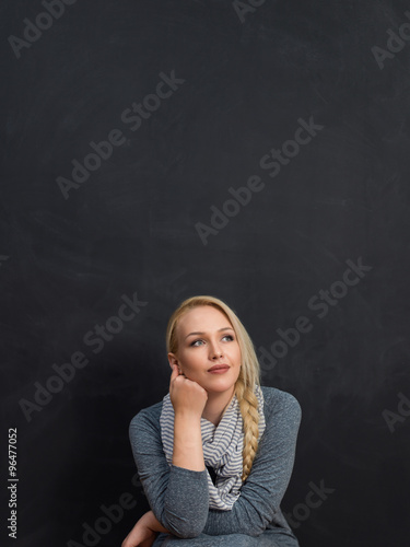smiling student or teacher at the blackboard