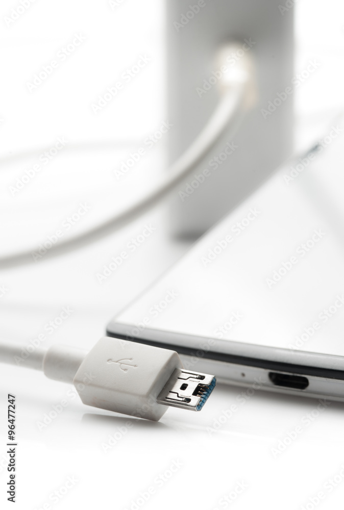 Smartphone with charger on white background,USB cable Smartphone with charger on white background,USB cable