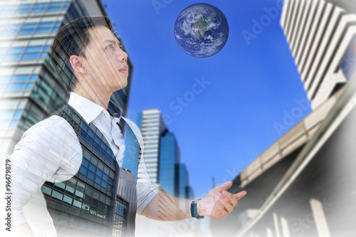 Double exposure of businessman with building and earth, Elements