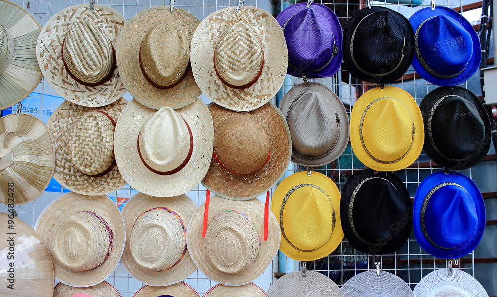 Row Of Vintage Weaving Hats Hanging On The Grille