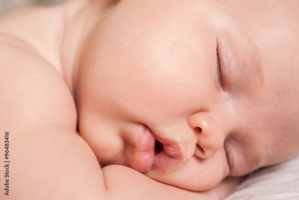 a sweet baby sleeping on a blanket a sweet baby sleeping on a blanket