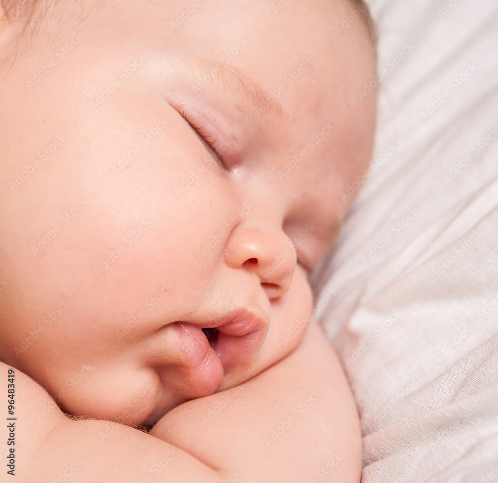 a sweet baby sleeping on a blanket a sweet baby sleeping on a blanket