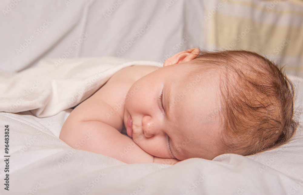 a sweet baby sleeping on a blanket a sweet baby sleeping on a blanket