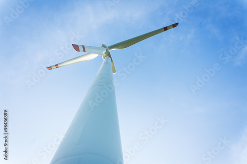  wind turbine generating electricity on blue sky