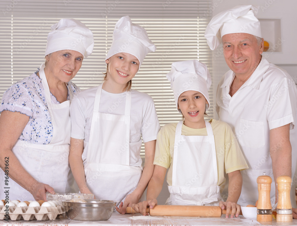 Happy family cooking together Happy family cooking together